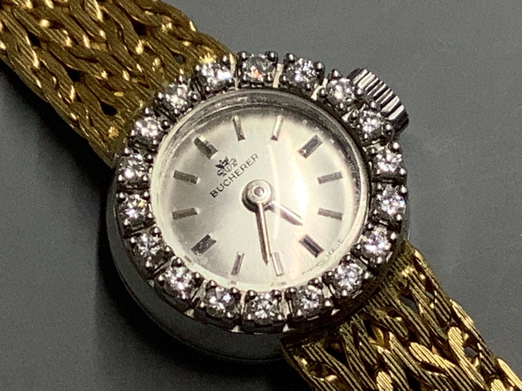 A lady's modern yellow metal (stamped 750) and diamond set Bucherer manual wind cocktail watch, with Bucherer box